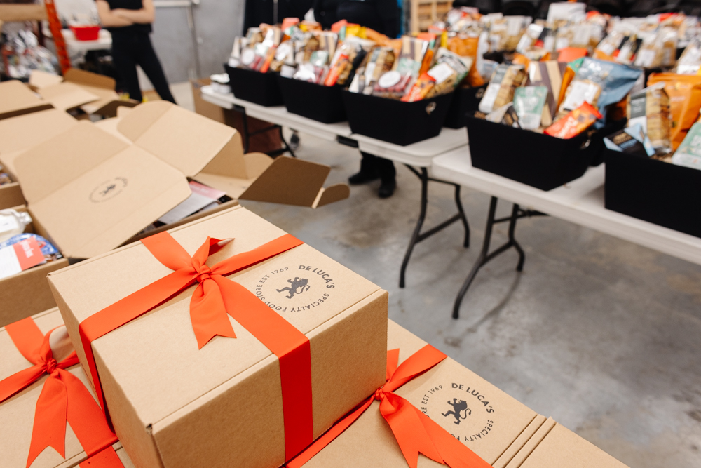 De Luca's gift boxes with red ribbons